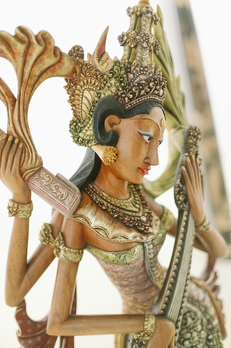 picture of a wooden statue of the goddess, saraswati